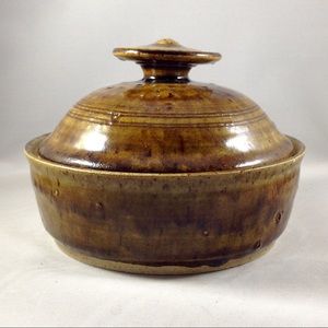 Art studio pottery lidded jar in burnt sienna
